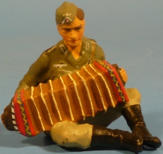 Soldat Zieharmonika spielend