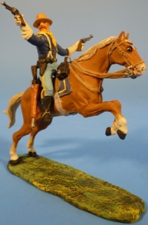 Kavallerist mit 2 Revolvern feuernd zu Pferd