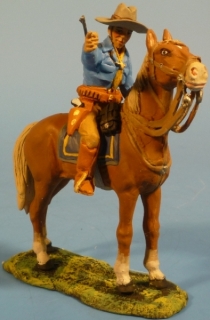 Cowboy zeigend zu Pferd