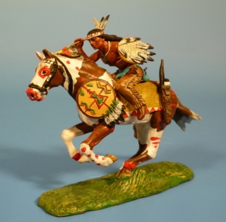 Indianer mit Kriegskeule und Schild im Angriff