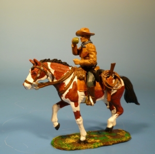 Cowboy zu Pferd Apfel essend