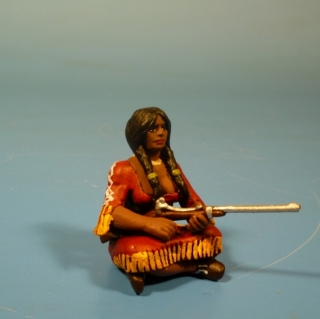 Squaw sitzend mit Gewehr