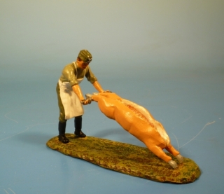 Feldmetzger ein Schwein ziehend