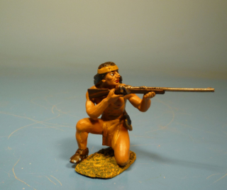Indianer kniend mit Gewehr schie�end