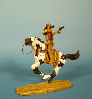 Apache zu Pferd mit Revolvern schieend