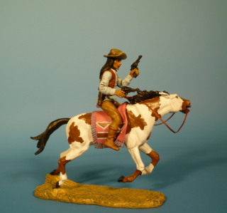 Apache zu Pferd mit Revolvern schie�end